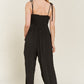 SMOCKED TIE STRAP JUMPSUIT